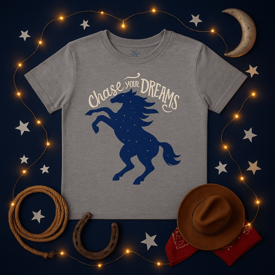 Gray t-shirt with blue horse graphic and 'Chase Your Dreams' text on a dark background with decorative elements.