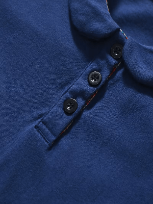 Close-up of a blue garment with buttons
