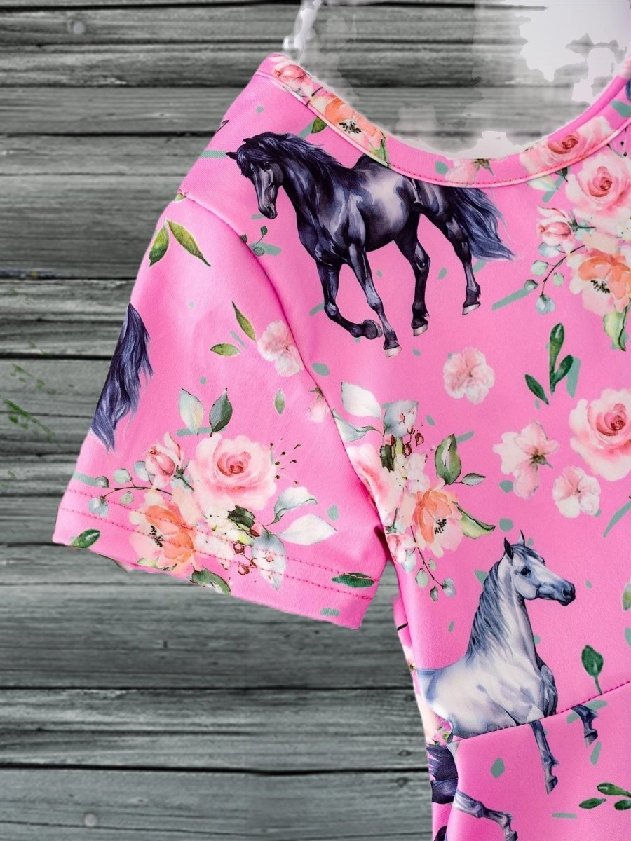 Pink equestrian print dress for girls featuring horses and floral patterns, ideal for Western pony lovers.