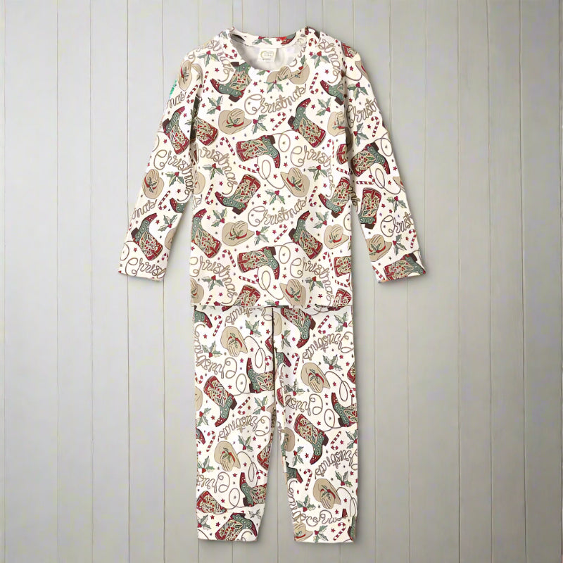 Western Christmas-themed pajamas set with festive cowboy boots and hats on a white background