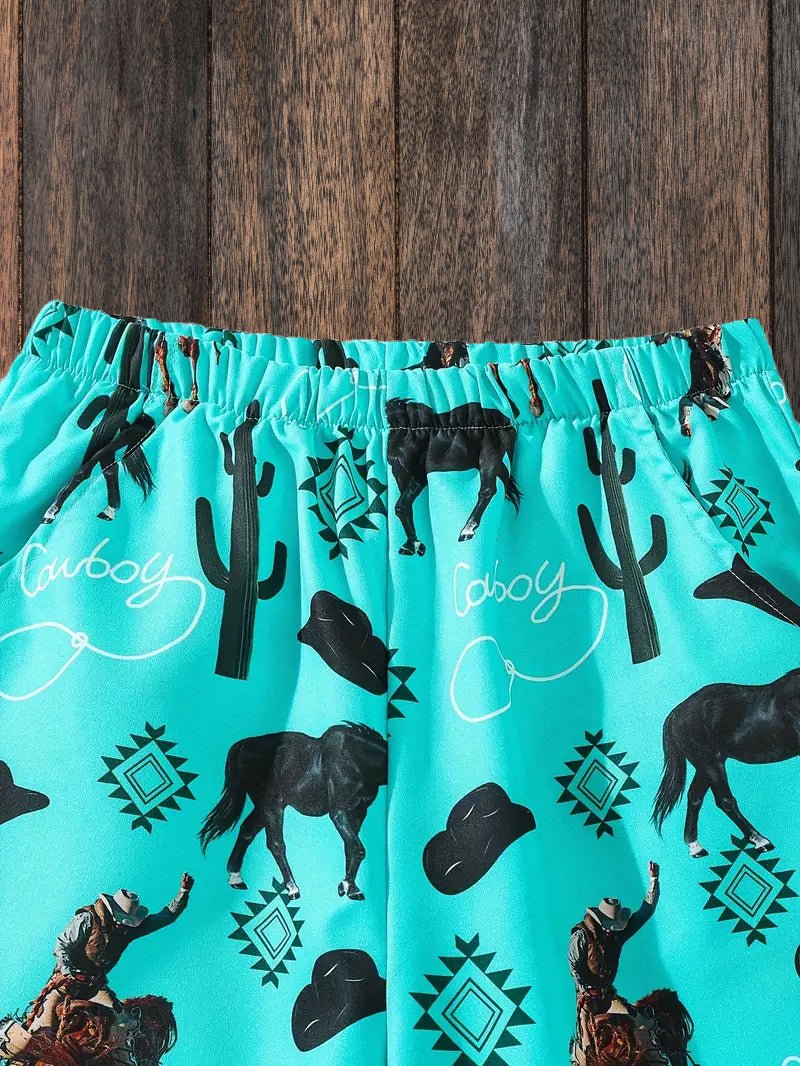 Boys western swim shorts with black cowboy print laid flat