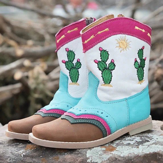 Pecos cactus leather boots on rock background