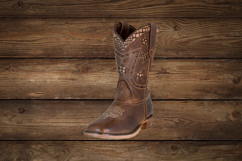 Side view of children's Western boots with square toe design and star stitching detail