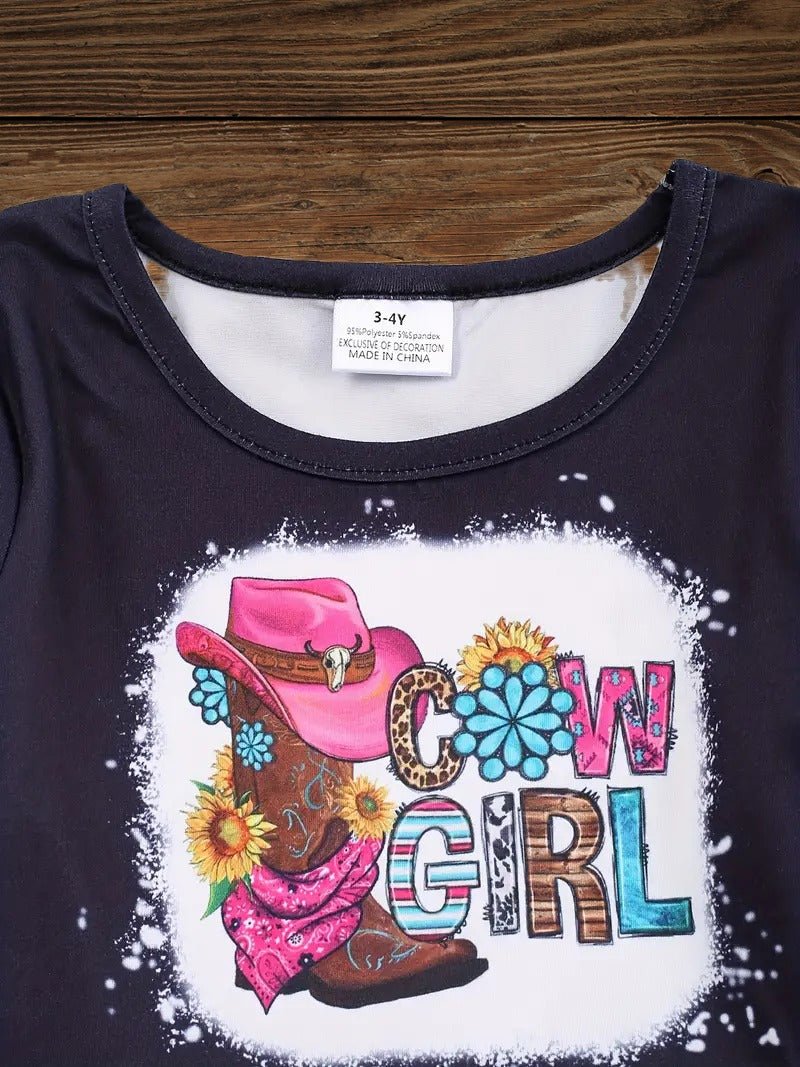 Close-up of Western cowgirl boot and hat graphic on pink cowgirl dress for girls, detailed toddler cowgirl dress design.