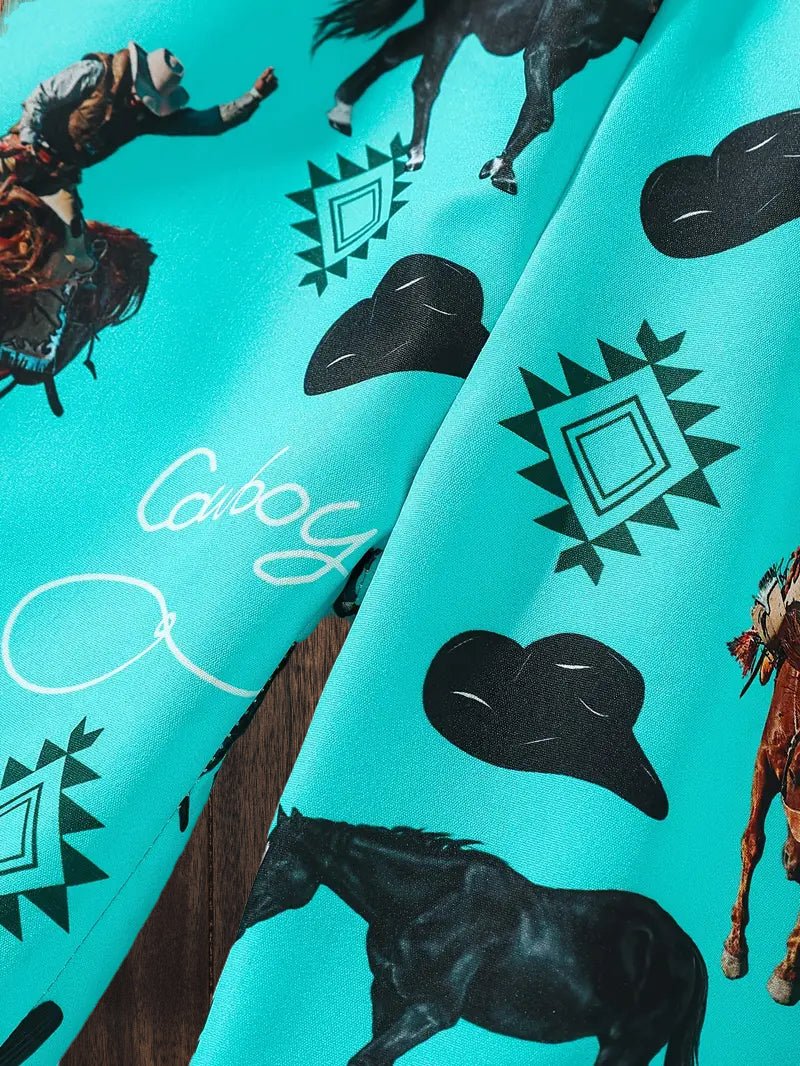 Detailed print view of cowboy and cactus design on western boys shorts