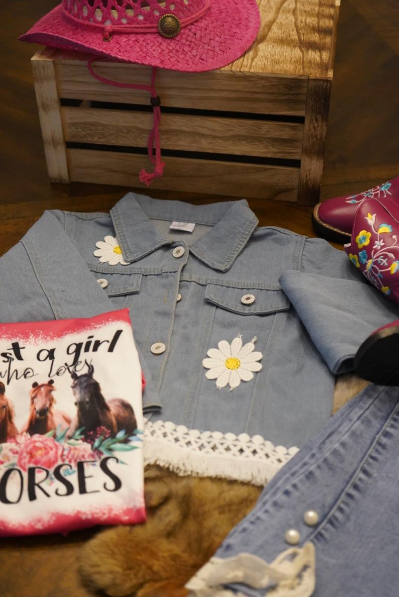 Western denim jacket for toddler styled with pink cowgirl hat, boots, and horse-themed accessories.