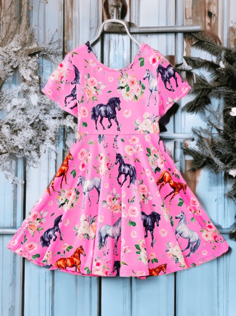 Pink equestrian print dress for girls with colorful pony graphics, short sleeves, and floral accents.