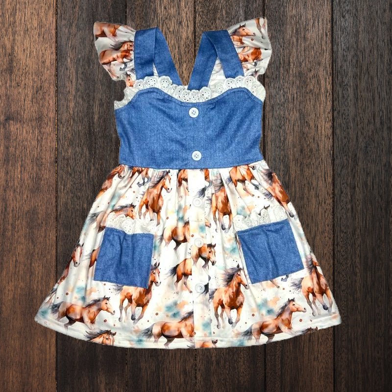 Flat lay of girls western horse print dress with denim bodice and pockets.