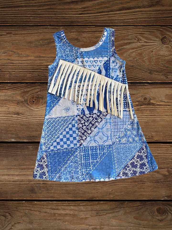 Flat lay of blue toddler suede fringe dress with bandana print
