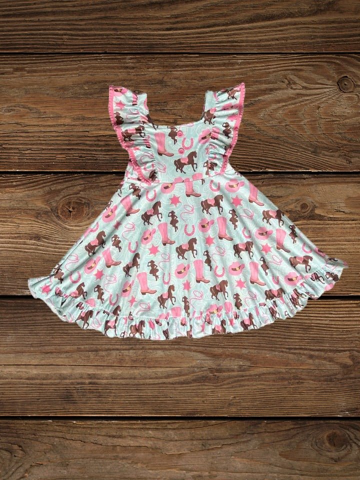 Flat lay of toddler teal western dress with pony print
