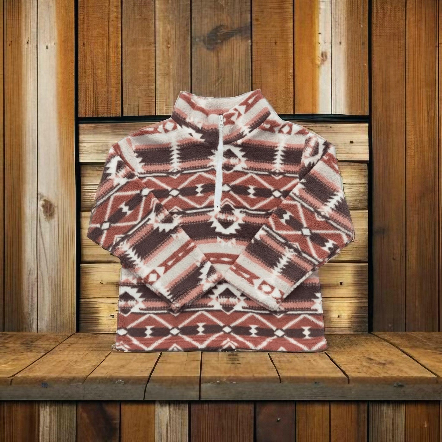 Folded Rust Brown Aztec print kids pullover, soft sherpa-lined western kids pullover for warm, stylish frontier wear.