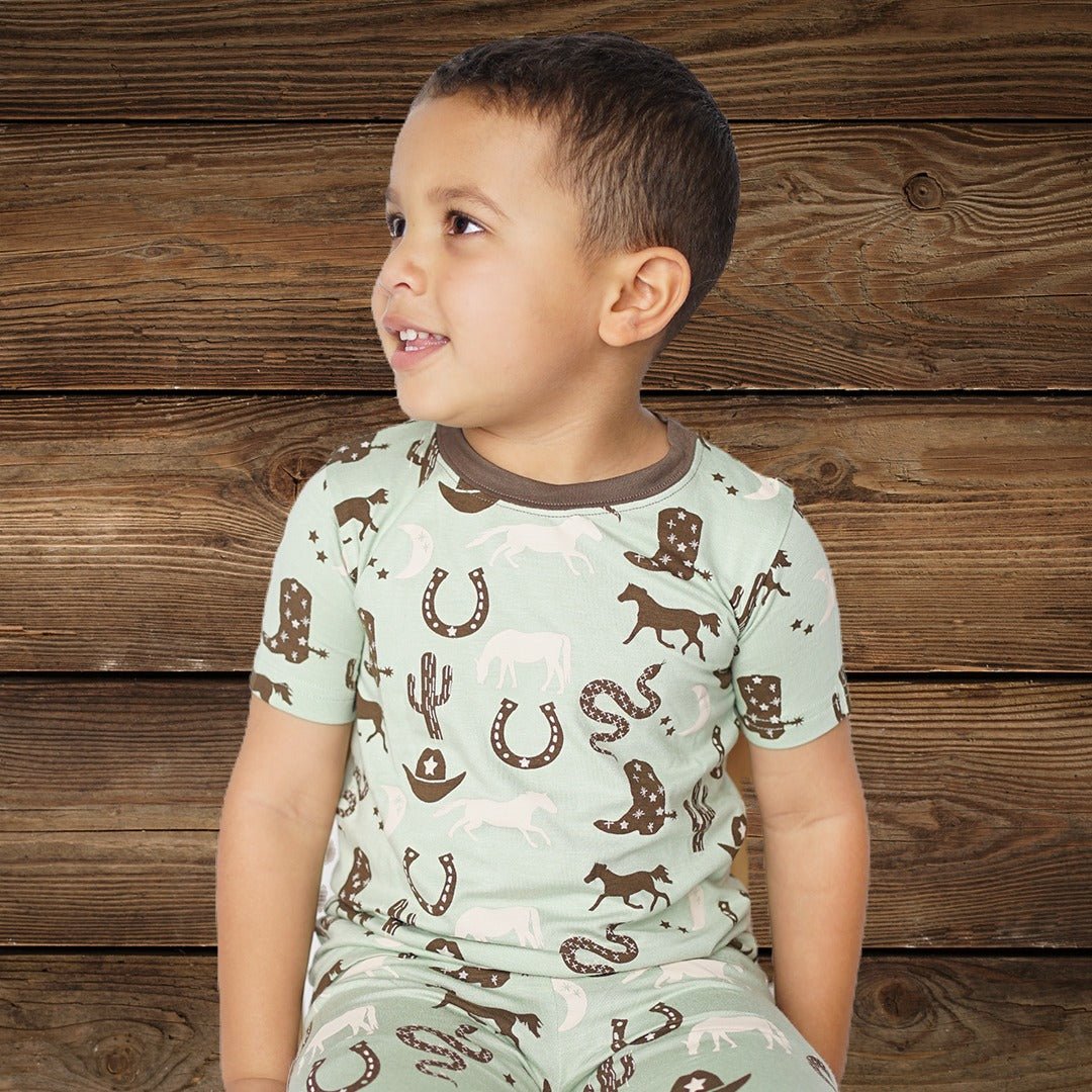 Close-up of horseshoe and boot print on pajamas