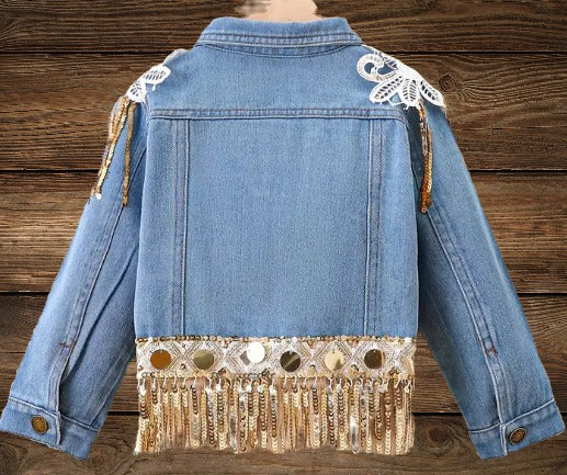 Back view of Glitter & Glamour Girls' Sequin Tassel Denim Jacket showing fringe and sequin detailing.