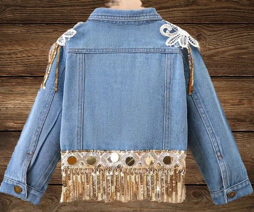 Back view of Glitter & Glamour Girls' Sequin Tassel Denim Jacket showing fringe and sequin detailing.