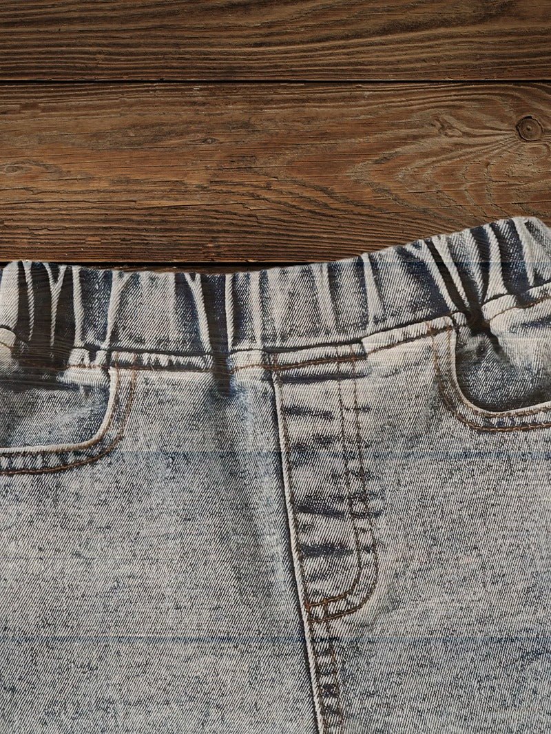 Back view of light wash kids jeans with tassel hem