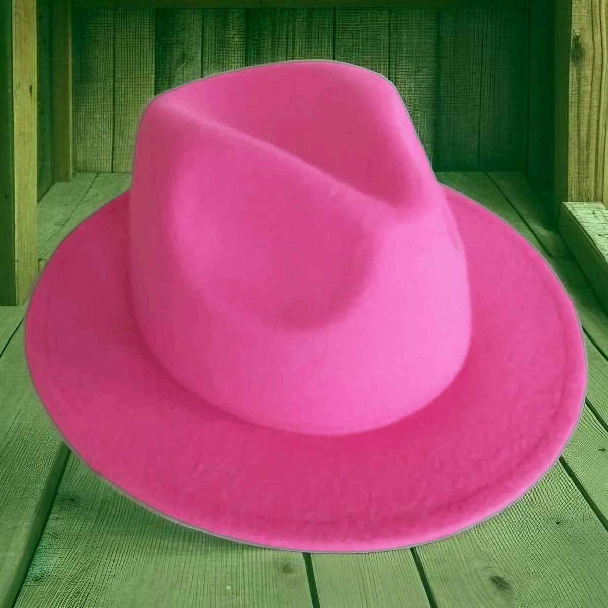 Fuchsia kids felt cowboy hat on grass background