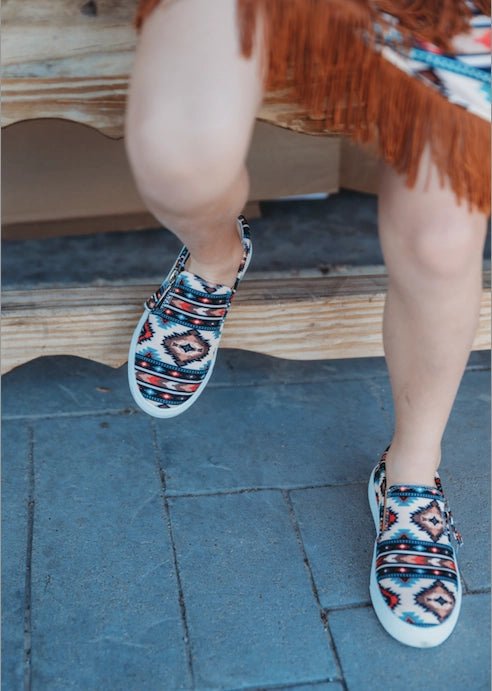 Feet of child walking in Trailblazer western sneakers