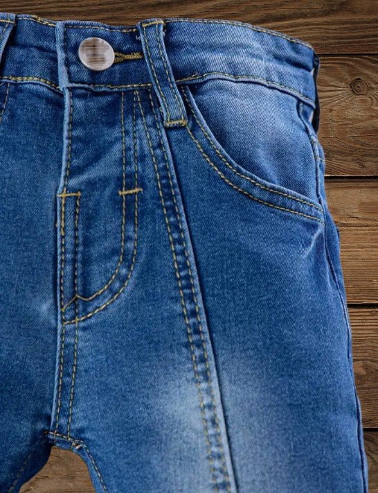 Waist and pocket detail on Lil' Wrangler cowgirl jeans for girls, featuring Western denim design.