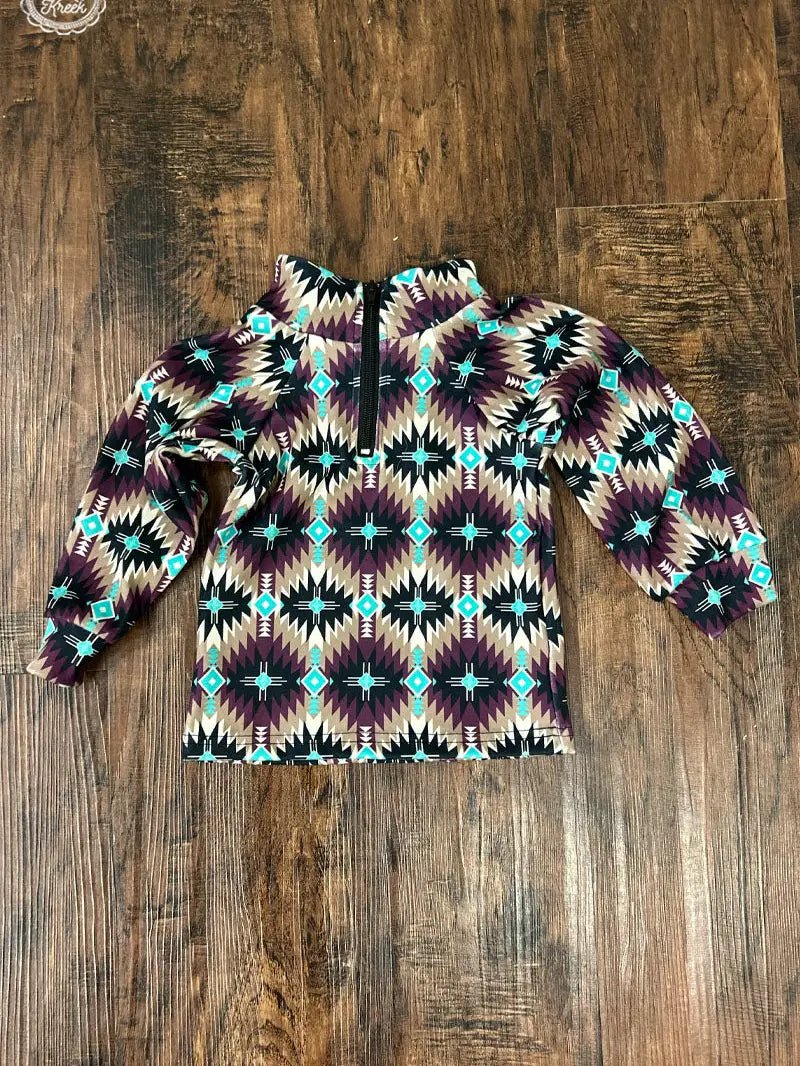 Mini Badlands Pullover flat lay showing dark purple and turquoise vibrant southwestern Aztec design, soft and stylish for kids.