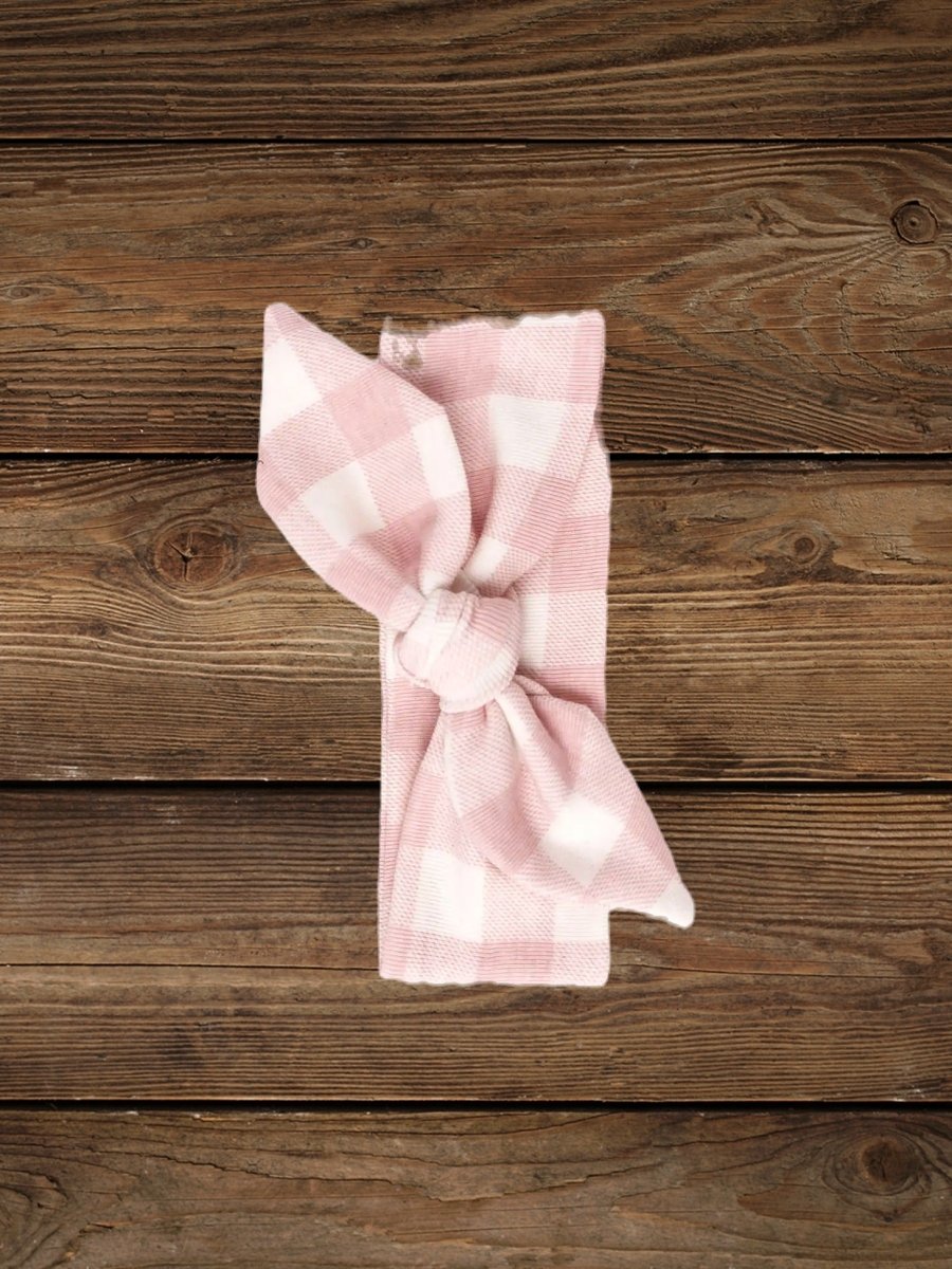 Flatlay of soft pink cotton baby headband