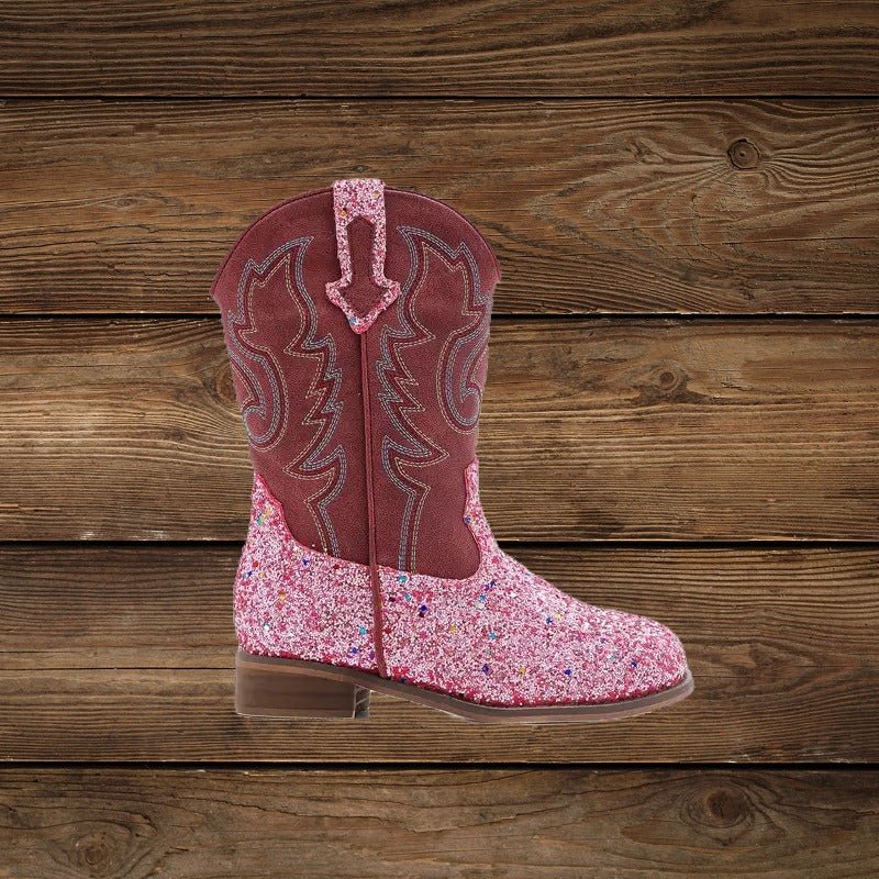 Side view of pink glitter cowgirl boot with embroidered shaft