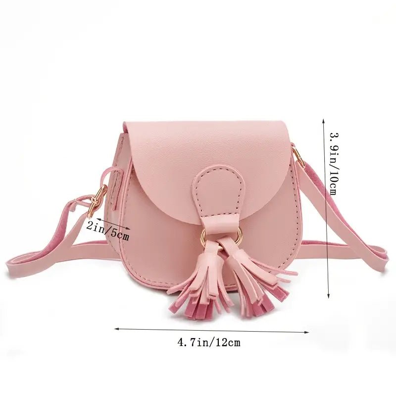 Pink mini crossbody purse with tassel showing detailed size measurements.