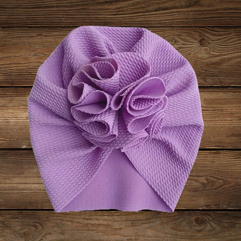 Purple turban hat with flower design for baby girls