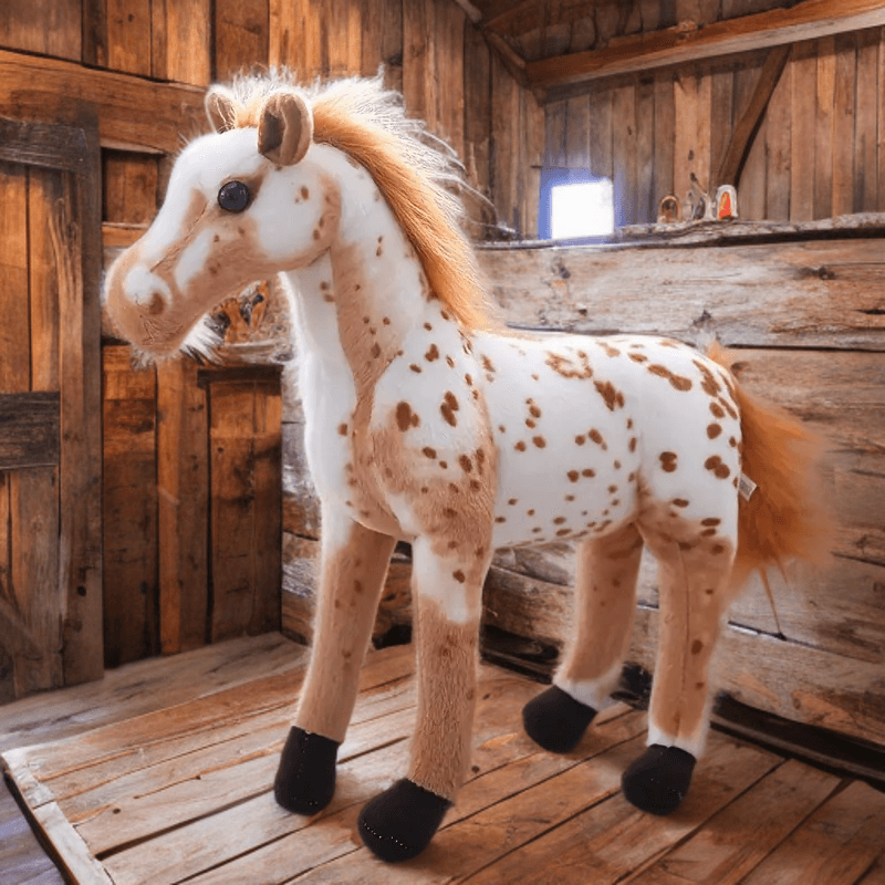 Realistic spotted appaloosa horse plush toy with soft mane in barn