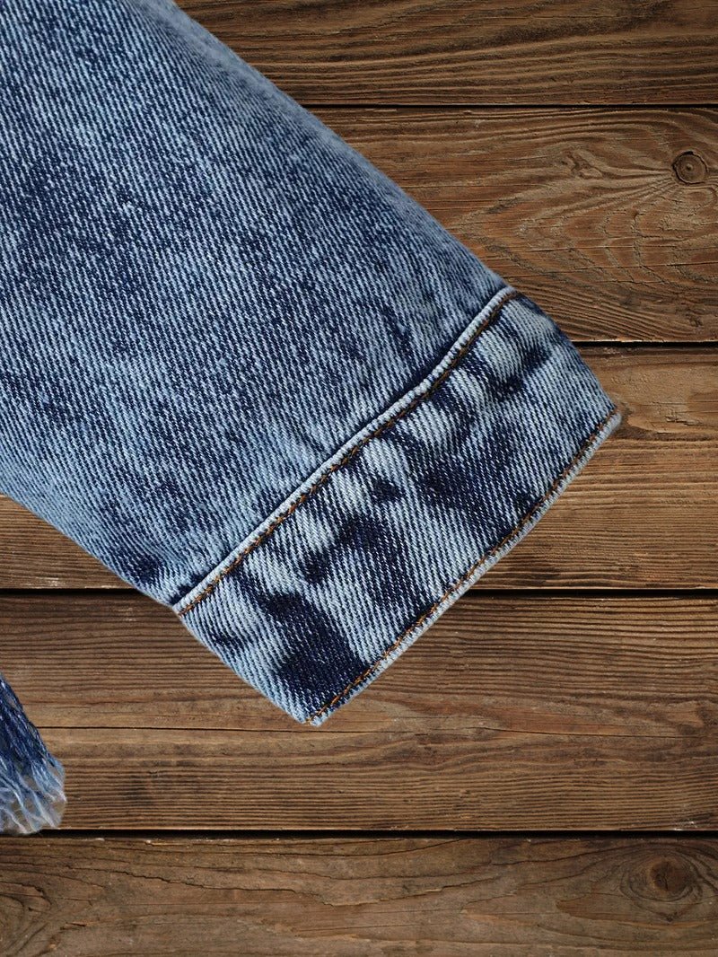 Close-up of sleeve cuff detail on Little Wrangler Raw Hem Denim Jacket for kids
