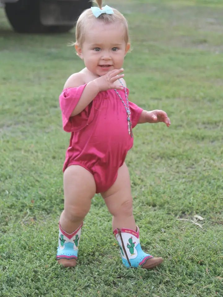 Toddler in pink dress wearing Pecos Cactus Boots