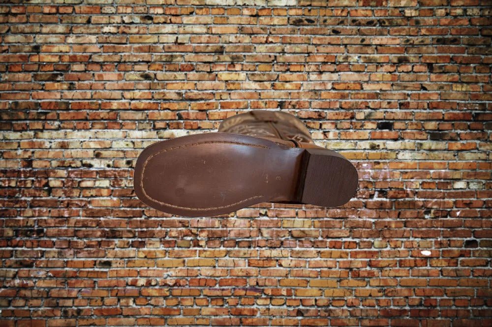 Bottom sole view of Tuffrider kids' Western boot for traction and durability detail.