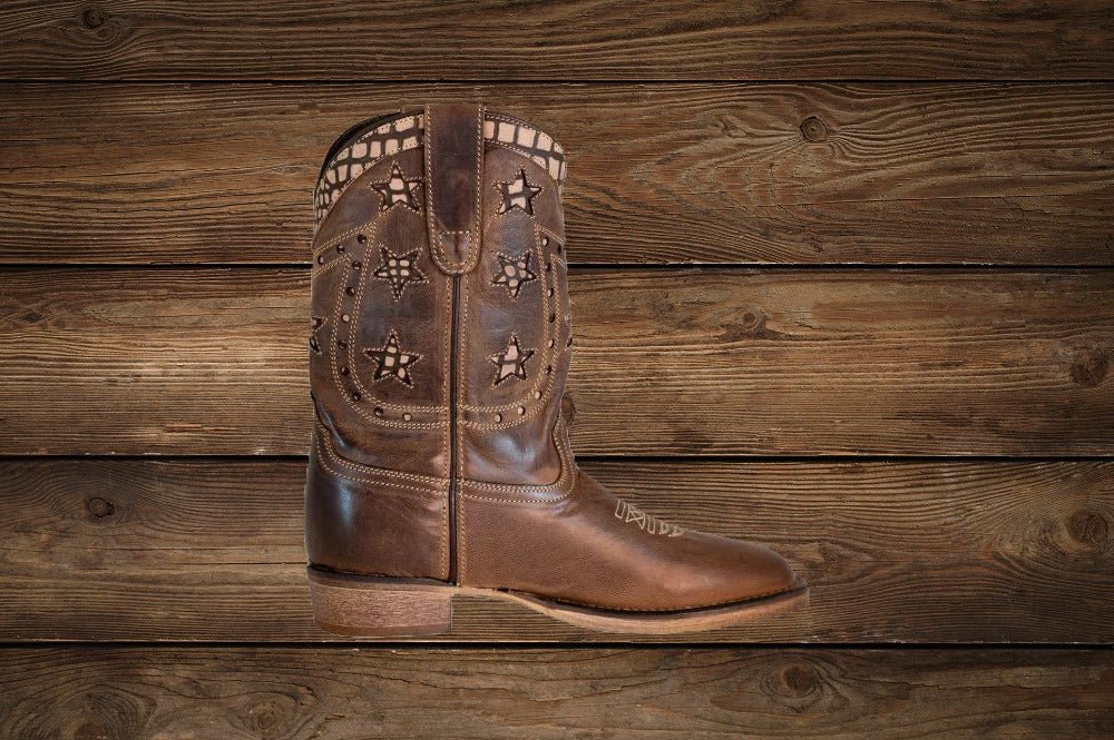 Close-up of TuffRider rodeo boots for kids showing star design and toe detail