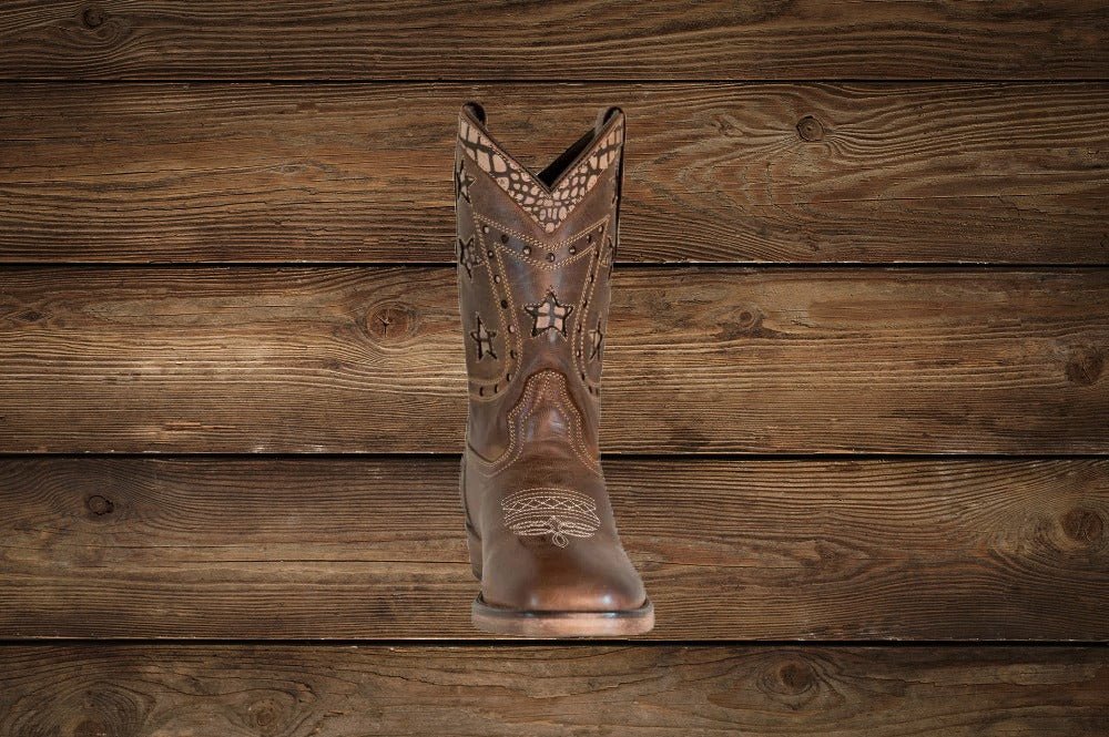 Close-up detail of TuffRider children's square-toe Western boot showing stitching and shaft design