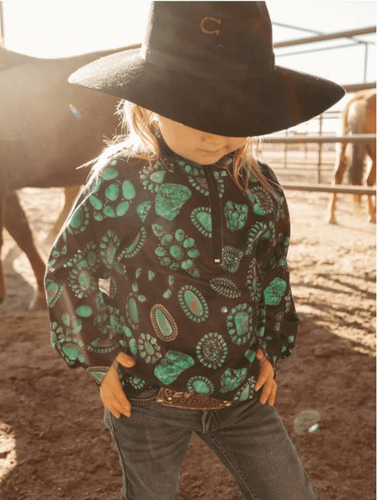 Girl wearing turquoise Navajo blossom Western pullover