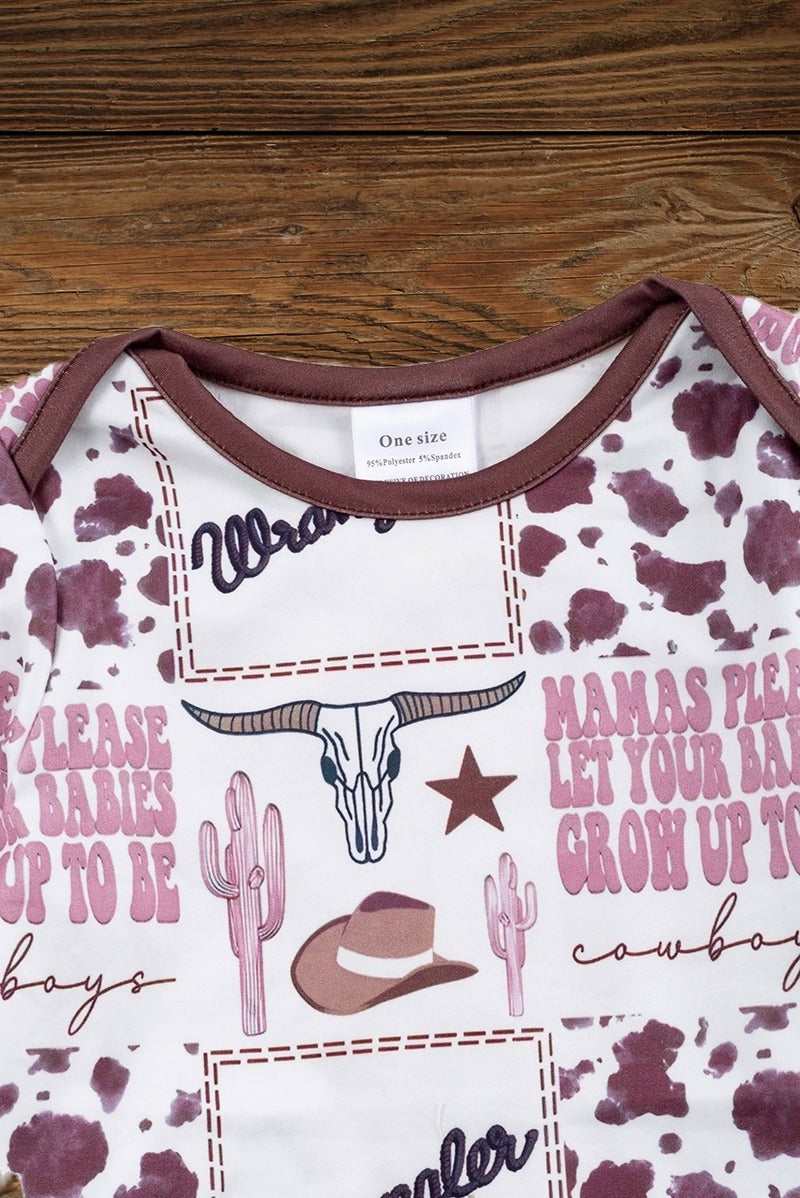 Cute baby boy onesie with western print details on wooden background
