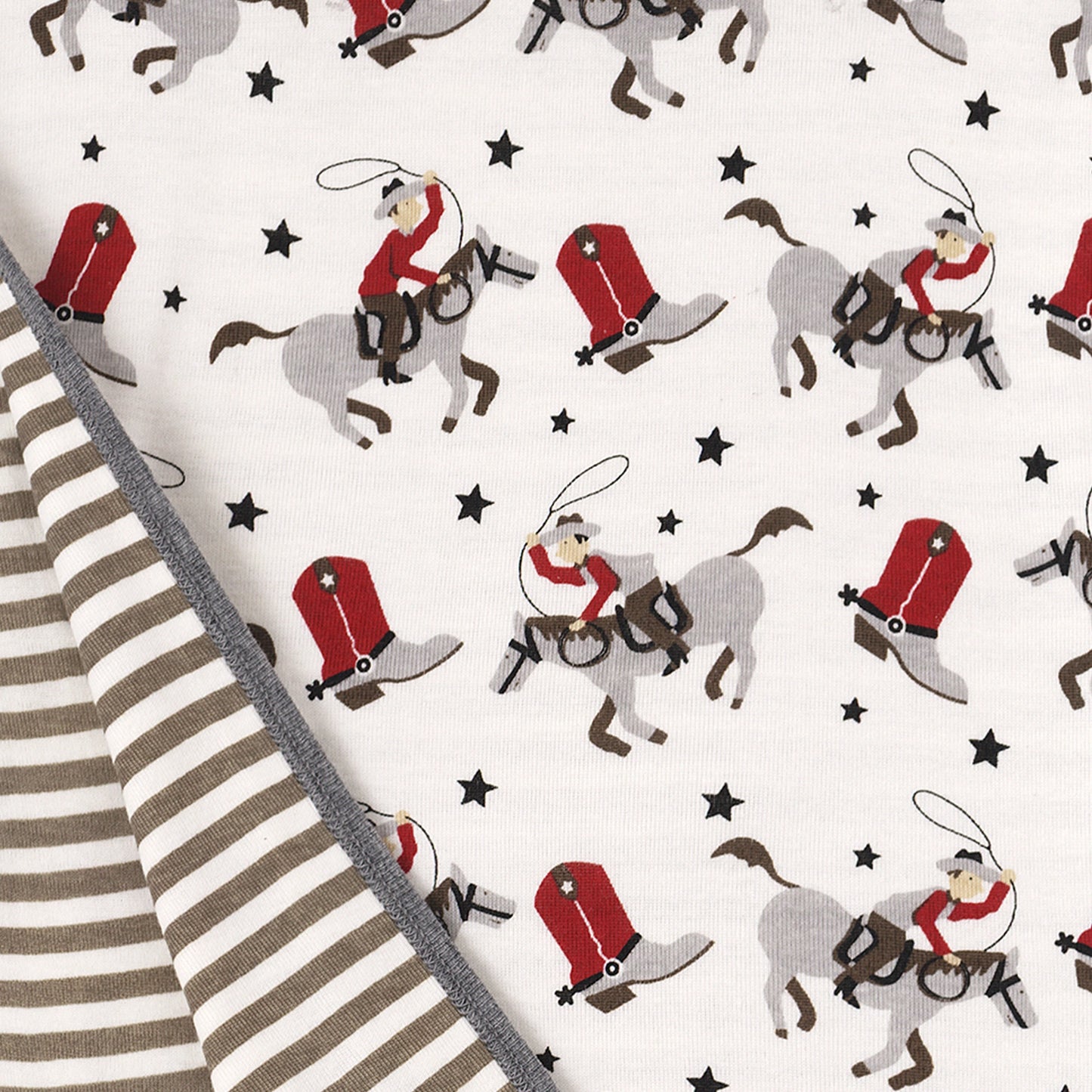 Red and black cowboy print detail on bamboo romper