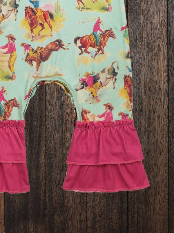 Close-up of pink ruffle leg detail on girls western rodeo print romper.