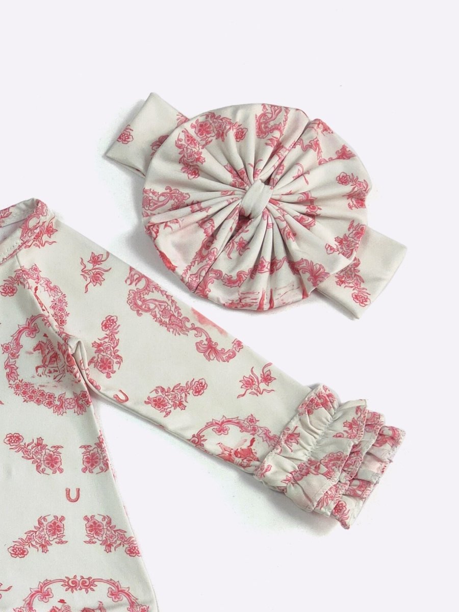 Set of white headbands with pink floral patterns on a white background