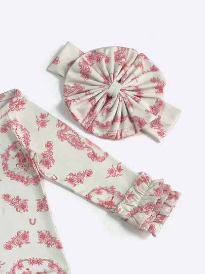 Set of white headbands with pink floral patterns on a white background