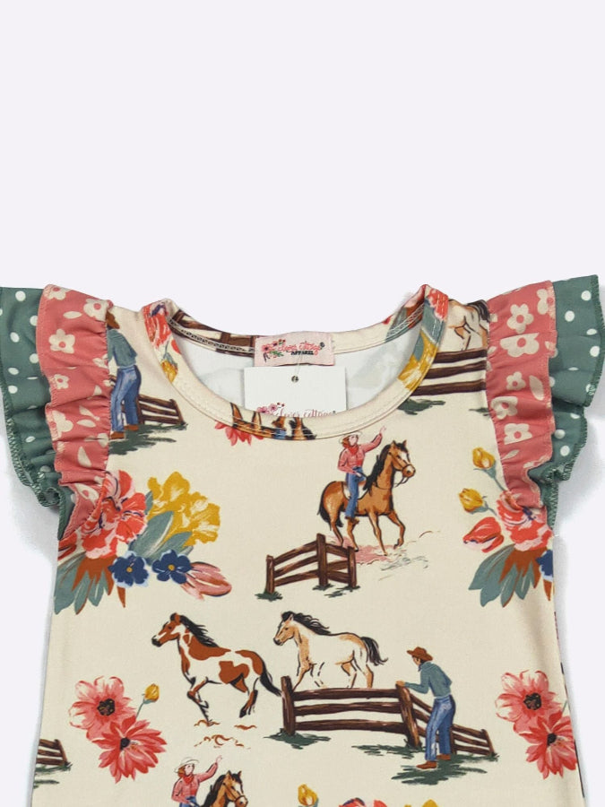 A children's short-sleeve top with ruffled sleeves, featuring a cream-colored base with a colorful equestrian and floral print, and green polka-dot ruffled sleeve trim.