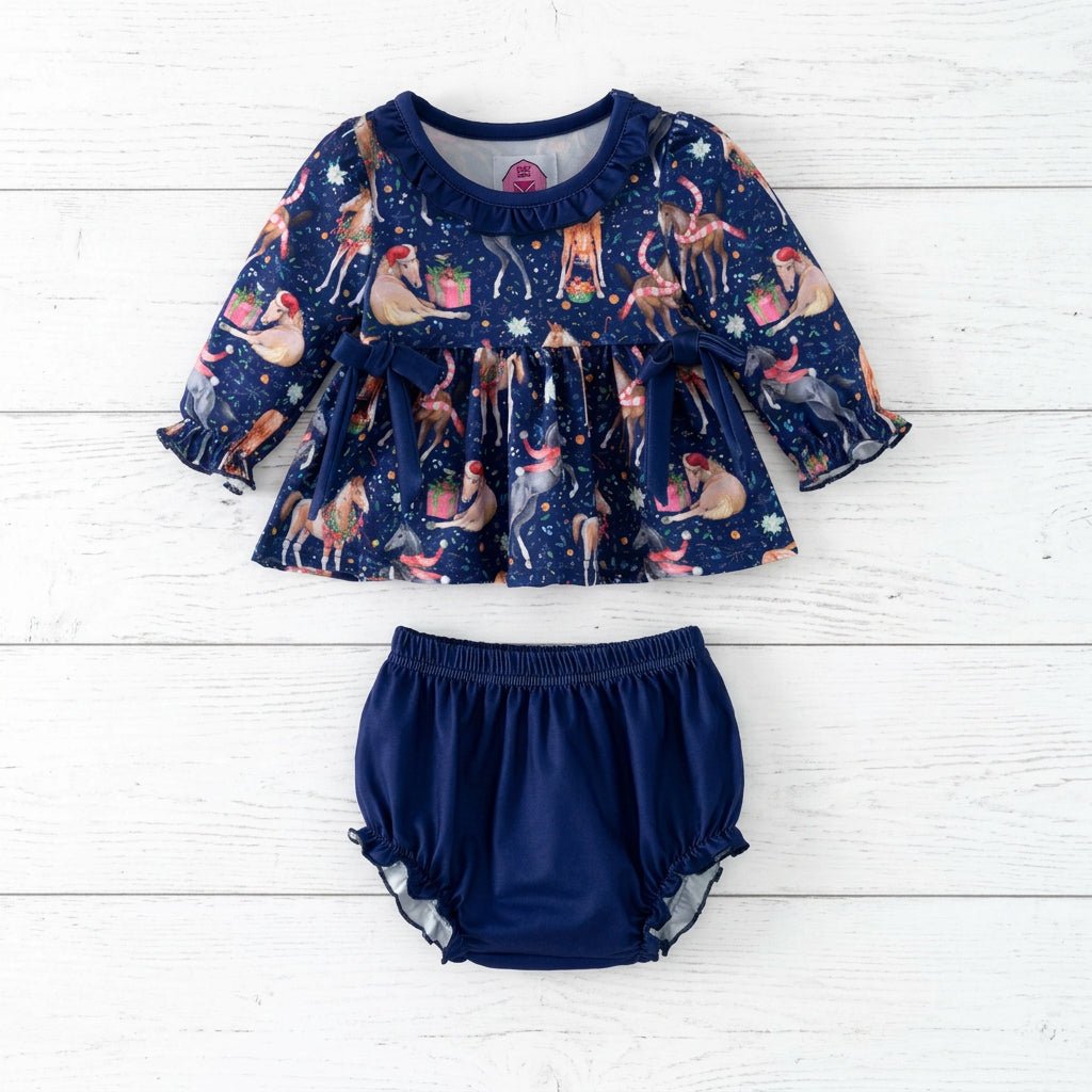 Christmas horse print baby set with a navy long-sleeve ruffle top, two waist bows and matching navy bloomers.