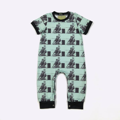 Children's romper with horse pattern on a light green background