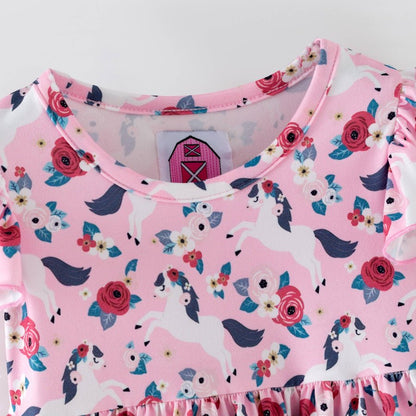 Pink children's romper with pony and floral pattern on a white background