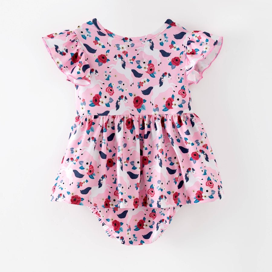 Pink floral baby romper on a white background