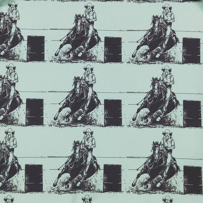 Repeating pattern of a cowboy on horseback with barrels on a light blue background