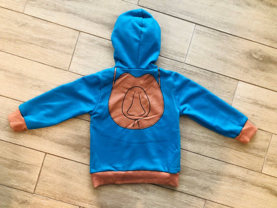 Blue hoodie with brown cowboy hat design on a wooden floor