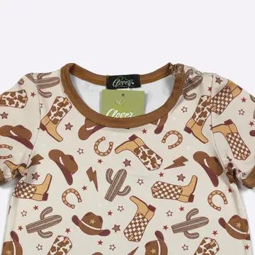 Baby romper wiith cowboy pattern on a white background
