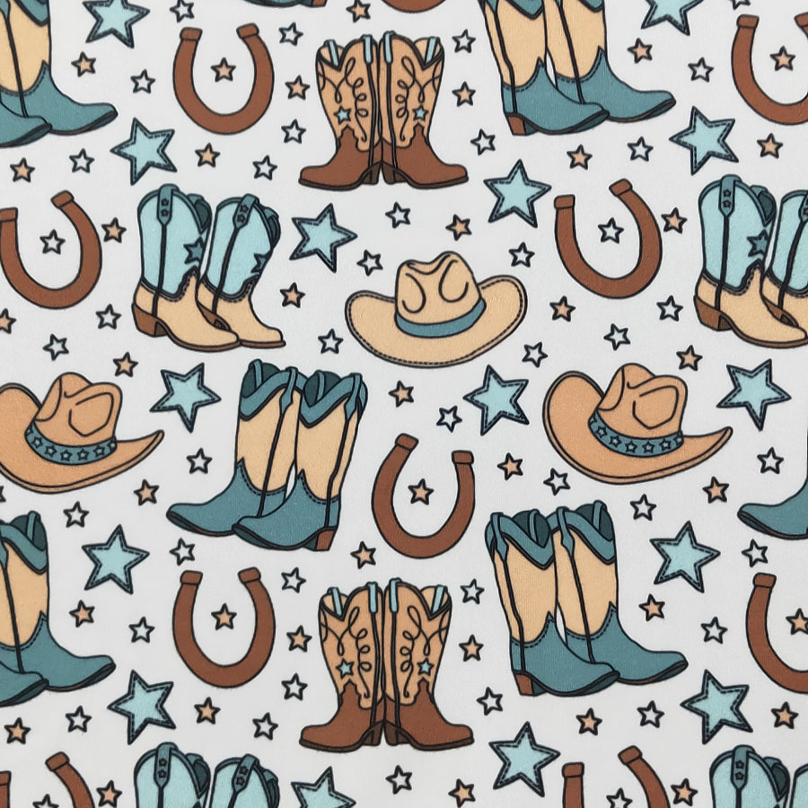 Pattern of cowboy boots, hats, and horseshoes on a white background