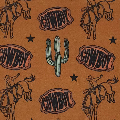 Pattern with cowboy text, horses, and a cactus on a brown background