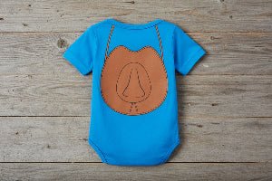 Blue back of romper with a brown cowboy hat on barnwood background
